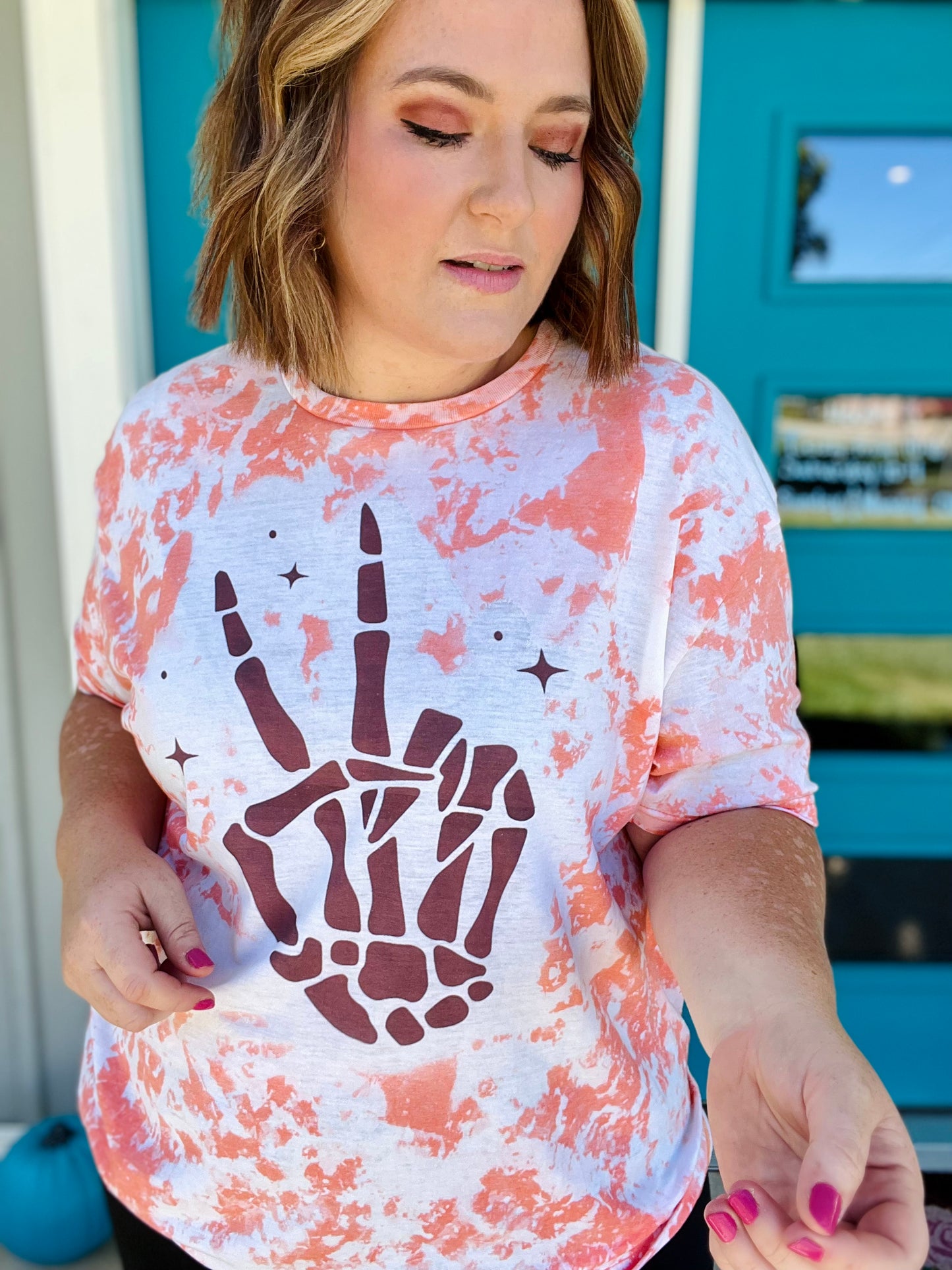 Skellie Peach Hands on Bleached Orange