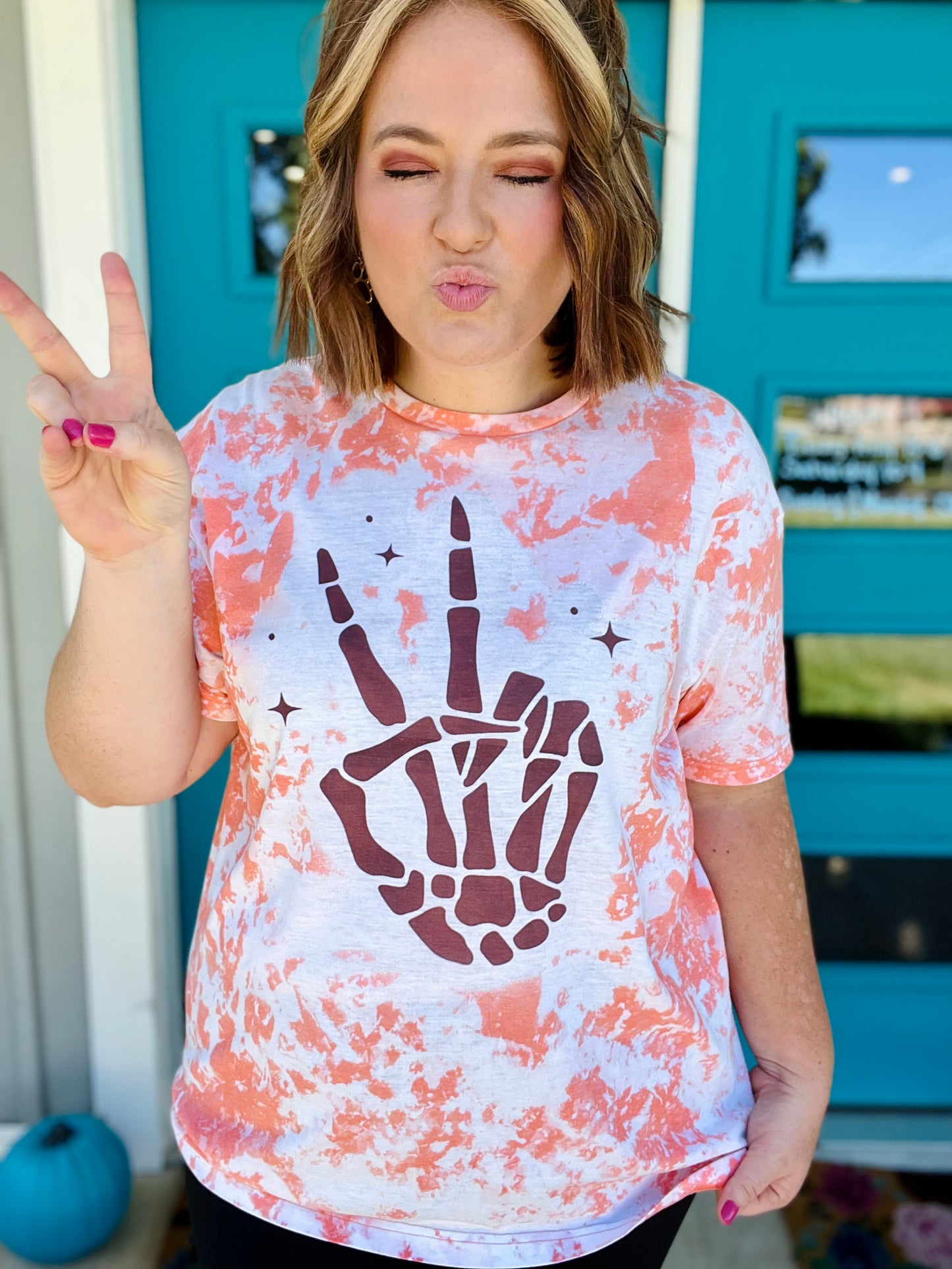 Skellie Peach Hands on Bleached Orange