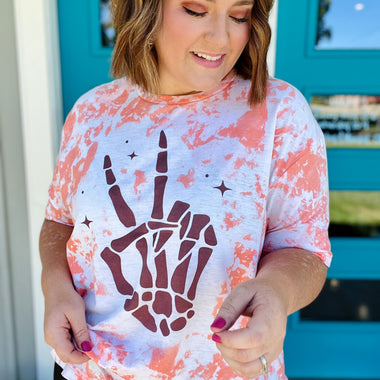 Skellie Peach Hands on Bleached Orange