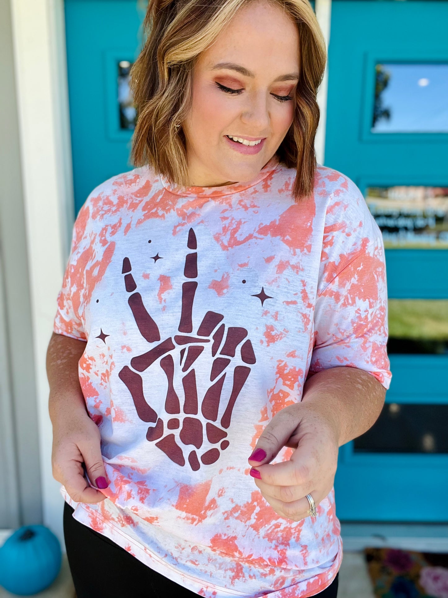 Skellie Peach Hands on Bleached Orange