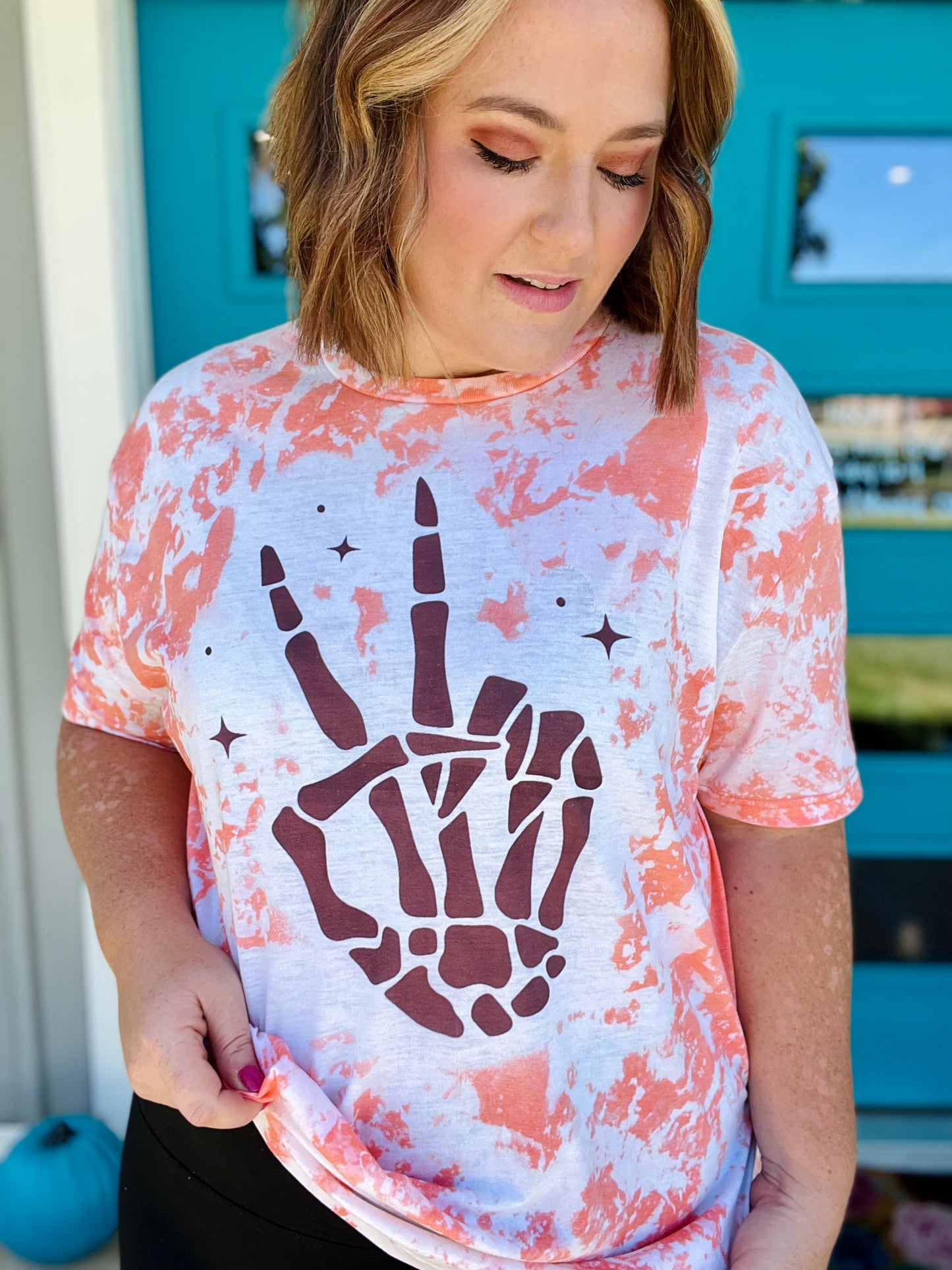 Skellie Peach Hands on Bleached Orange
