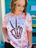 Skellie Peach Hands on Bleached Orange