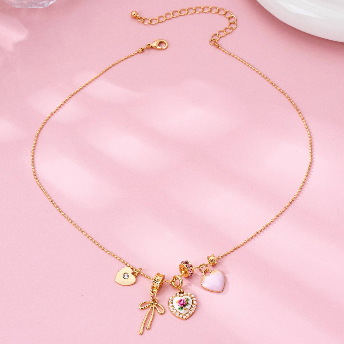 Multi Charm Porcelain Bow Ball Chain Necklace