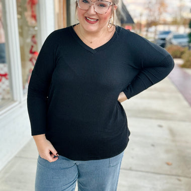 **DOORBUSTER** Karen V Neck Ribbed Top In Black